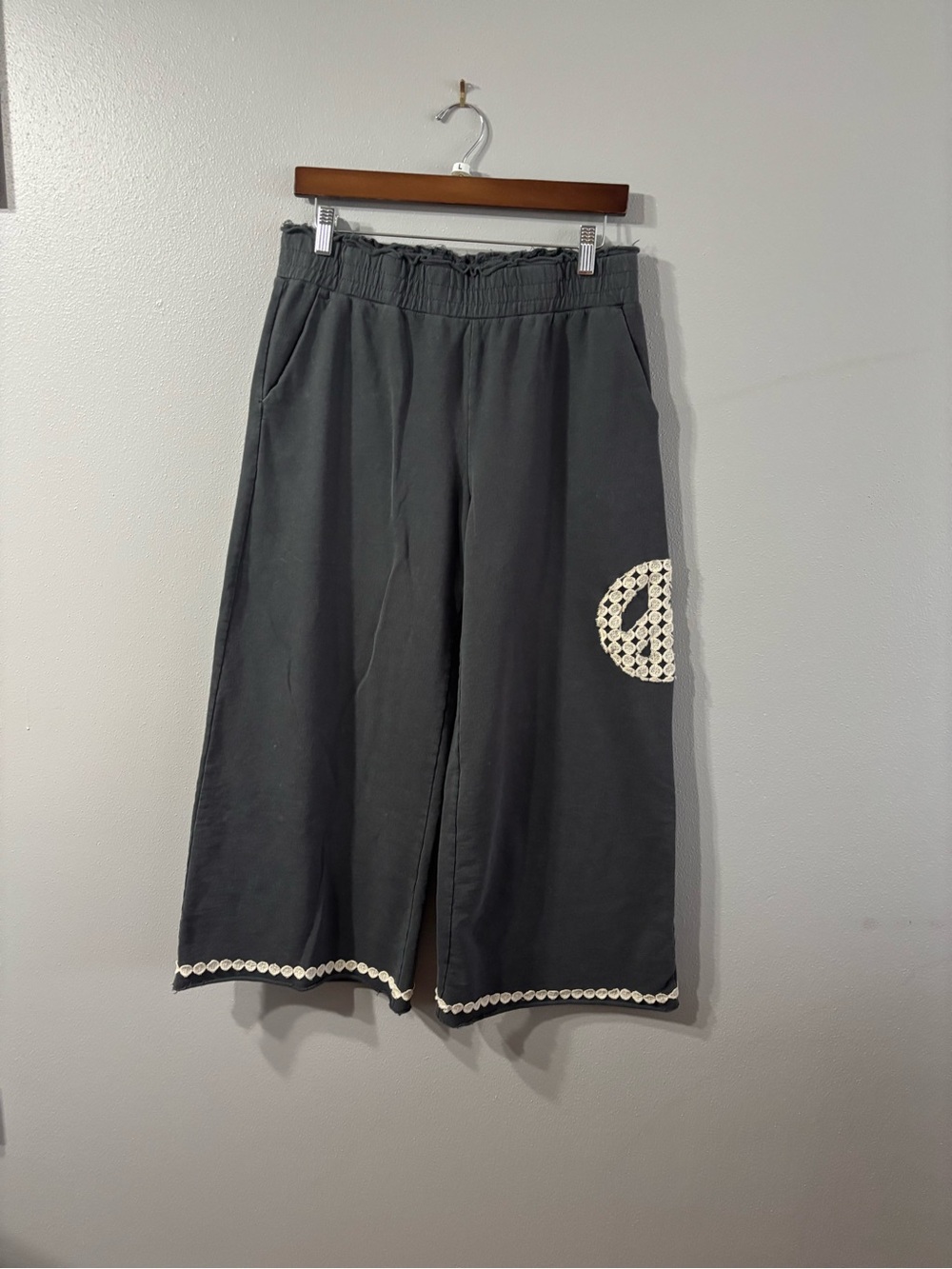 Umgee Black Wide-Leg Cropped Sweatpants with Crochet Peace Detail